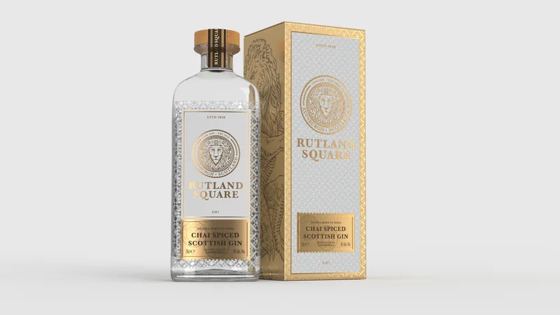 A bottle of Rutland Square Chai Spiced Scottish Gin beside its gold gift carton, which carries the lion seal, the Rutland pattern and an engraved lion
